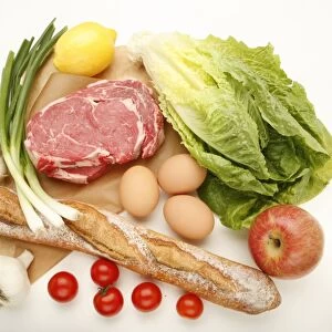 Bread, meat and eggs with vegetables and fruit