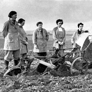 British girls of the Womens Land Army learning to plough with a tractor. World