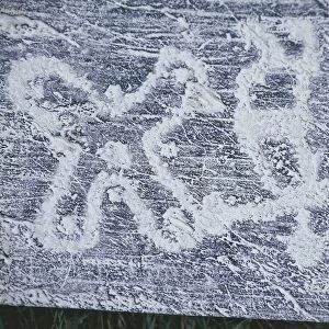 Camunian rose, copy of rock engravings in Valcamonica Valley, charcoal drawing, frottage technique
