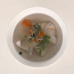 Clear soup (suimono), knotted fillet of sawara fish floating in mild broth with sprig of kinome
