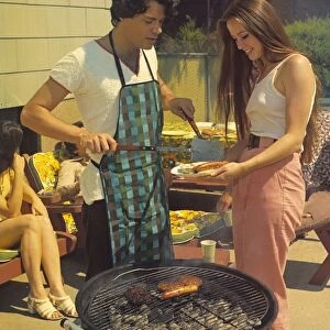 Couple grilling at the barbecue