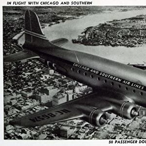 Douglas DC-4 in Flight. ca. 1946, New Orleans, Louisiana, USA, IN FLIGHT WITH CHICAGO AND SOUTHERN. 50 PASSENGER DOUGLAS DC-4 OVER CITY OF ORLEANS
