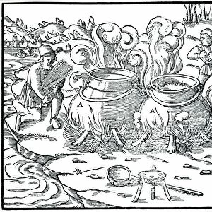 Evaporating sea water in iron pots to obtain salt. Straw being used as fuel. From