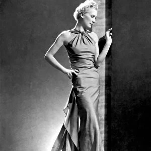 A fashion shot from France showing an evening dress with its dou