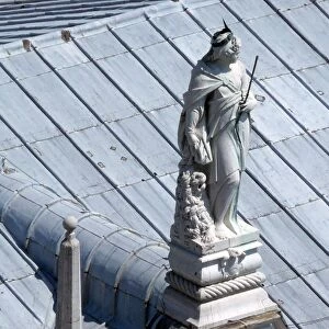 Female statue on rooftop