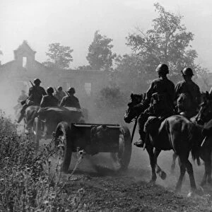 A horse-drawn artillery unit entering a village on the western bank of the don river, august 1942