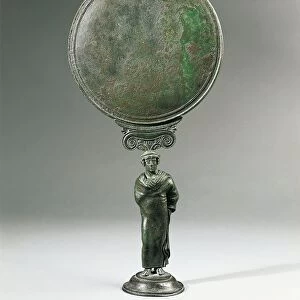 Italy, Calabria, Locri, Bronze mirror decorated with a statuette representing an ephebos (ephebe) wrapped in a cloak