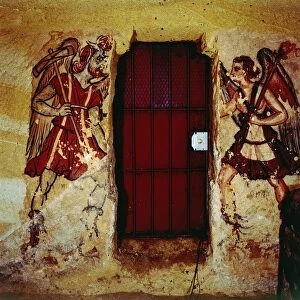 Italy, Latium Region, Tarquinia, Etruscan Necropolis, Tomb of the Anina Family, door between frescoes depicting Etruscan death demons Charun e Vanth