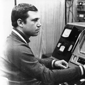 Luna 21 mission, a technician working the controls of the soviet remote-controlled lunar rover, lunokhod 2 at the distant space communications center, january 1973, (wire photo)