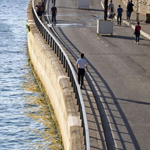 Man walking by the River Seine, Paris