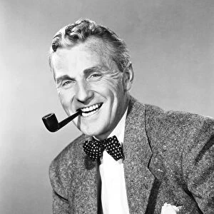 Mature man with bow tie smoking pipe