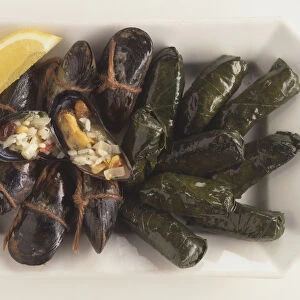 Midye dolmasi, Turkish dish of mussel shells stuffed with rice, garnished with lemon wedges