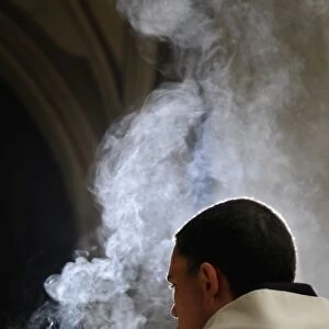 Monk holding an incense bowl during an oecumenical celebration