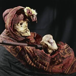 Mummy richly dressed and wrapped in a shroud, Peru, Paracas culture
