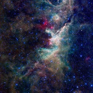 NASAs WISE captured this image of a hidden star-forming cloud of dust