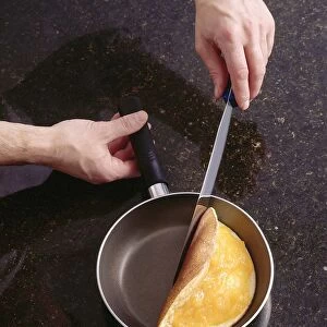 omelette being cooked in a frying pan