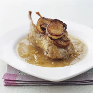 Partridge served in its cooking liquor and topped with slices of porcini