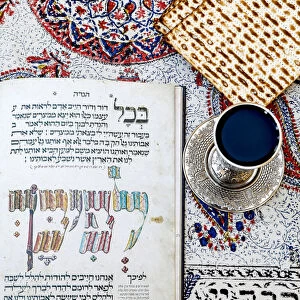 Passover Seder Haggadah in a Jerusalem jewish home, with wine and matsa