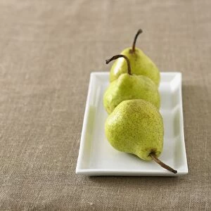 Three pears on a rectangular plate
