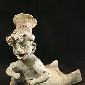 Polychrome terracotta statue depicting dancing priest wearing headdress from Bahia de Caraquez, 5th century B. C. -5th century A. D