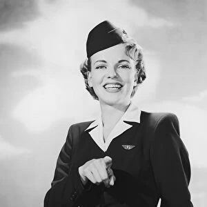 Portrait of stewardess pointing