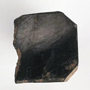 Rough columbite, a black mineral also called niobite, niobite-tantalite, and columbate