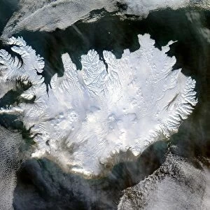 Satellite image of Iceland on 28 January 2004 showing it covered in a blanket of snow