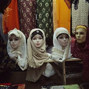 Singpore, Singapore City, Geylang Serai, Geylang Serai Market, traditional headscarves displayed on model heads
