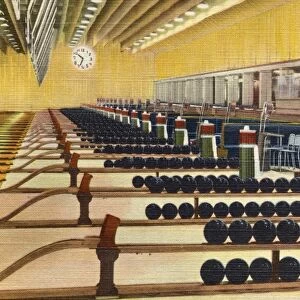 Sunset Bowling Center. ca. 1945, Hollywood, Los Angeles, California, USA, Hollywood, CA. An impressive spectacle of unequalled color is offered by a view of the 26 ball racks and the chalk boxes which stand at attention at the head of Sunset Bowling Centers 52 lanes. Balls and equipment were selected only from the very finest stock. Sunset Center is located on the Warner Bros. lot where Hollywoods first talking picture was made