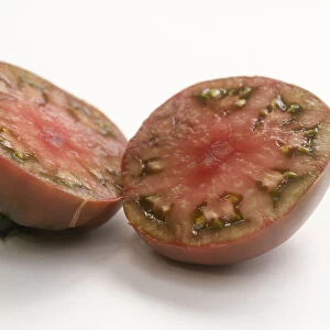 Tomato Black Russian, heirloom tomato, cut in half, close-up