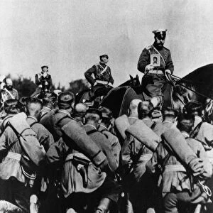 Tsar nicholas ll, on horseback holding an icon, during prayers before a battle at the front in world war i