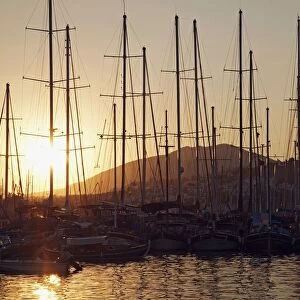 Turkey, Bodrum, sunset view of boats in harbour
