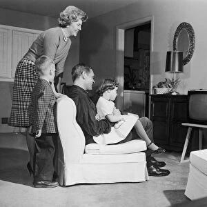 Vintage image of family watching television
