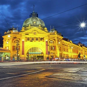 Facade of Flinders Street station illuminated at night