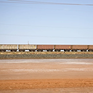 Freight train moving through a desert landscape, Port Hedland, Western Australia, Australia
