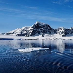 Mountain Range Along Danco Coast With a Floating Ice in the Foreground, West Coast Of The Antarctic Peninsula, Antarctica