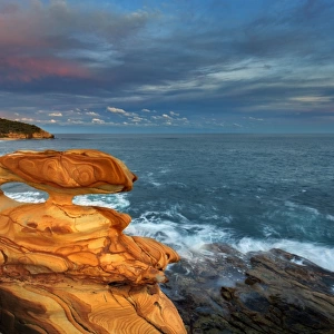 Sunset over spectacular coastal rocks