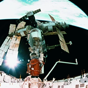 View from a wide angle lenses of a space station docking in orbit