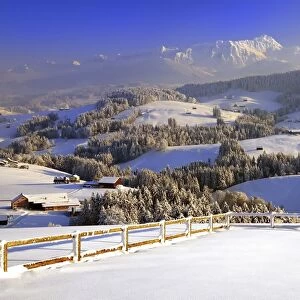 Appenzeller winter landscape in evening light with view on the Santis, Appenzell, Switzerland