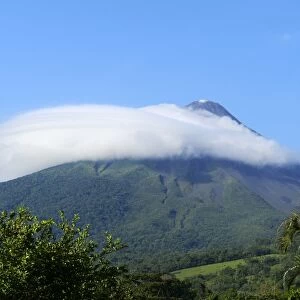 Arenal volcano capped by a cloud, La Fortuna, Costa Rica, South America