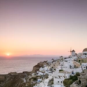Awesome sunset on town of Oia, Santorini, Greece