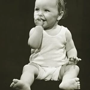 Baby boy (12-18 months) sucking thumb, (B&W), close-up