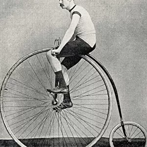 Cyclist J. H. Adams on a penny farthing bicycle, side view