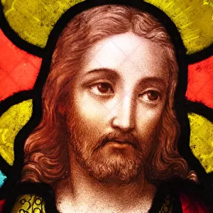 The face of Jesus Christ on an antique stained glass window
