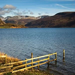 Fence on lake shore at Lake District, Cumbria, England