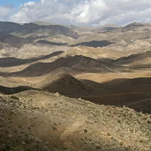 Interplay of light and shadow on a hilly landscape, Richtersveld, Richtersveld Nationalpark, Northern Cape, South Africa