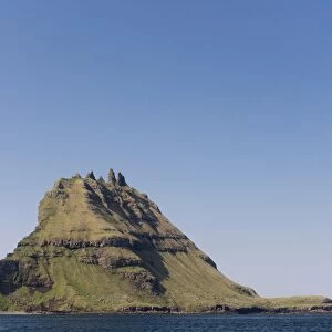 Islet of Tindholmur or Tindholmur, rugged cliffs rising from the sea, Vagar, Faroe Islands, Denmark