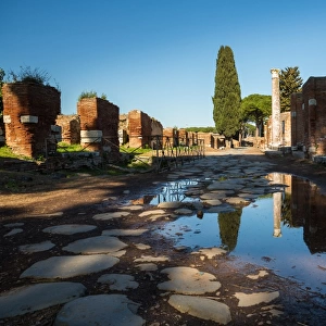 A large puddle in the ruins of the Ancient Roman harbour city of Ostia Antica in Rome, Italy