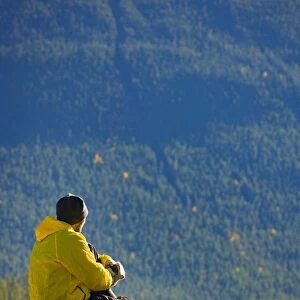 Man sitting on a mountain in Jasper National Park, Alberta