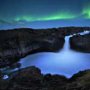 northern lights over Aldeyjarfoss waterfall in Iceland